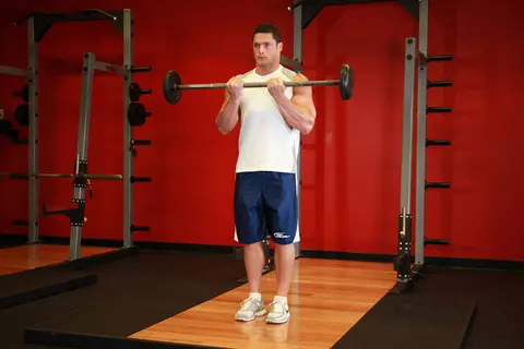 Close-Grip Standing Barbell Curl — end position