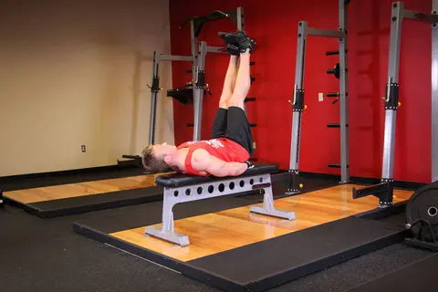 Flat Bench Lying Leg Raise — end position
