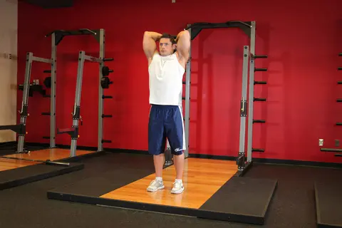 Standing Dumbbell Triceps Extension — end position